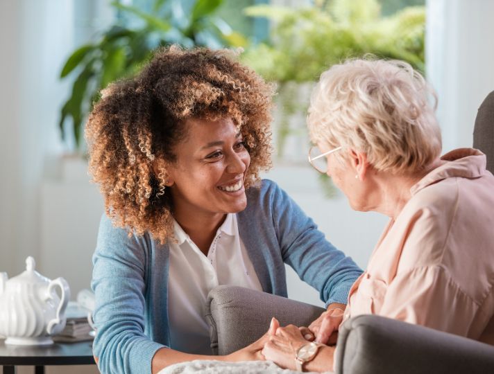 lady caring for an elderly person